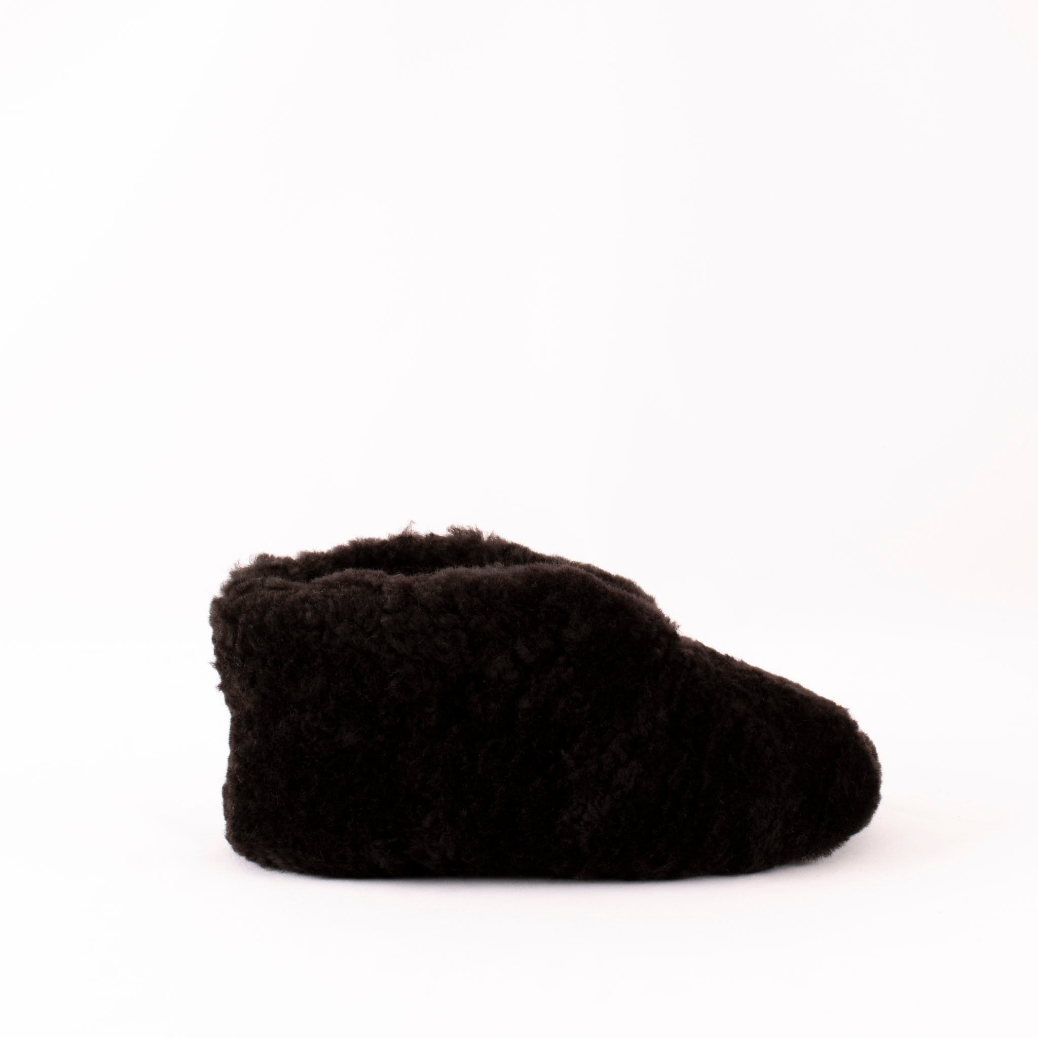Shepherd Ulla are a pair of soft ankel high sheepskin slippers.