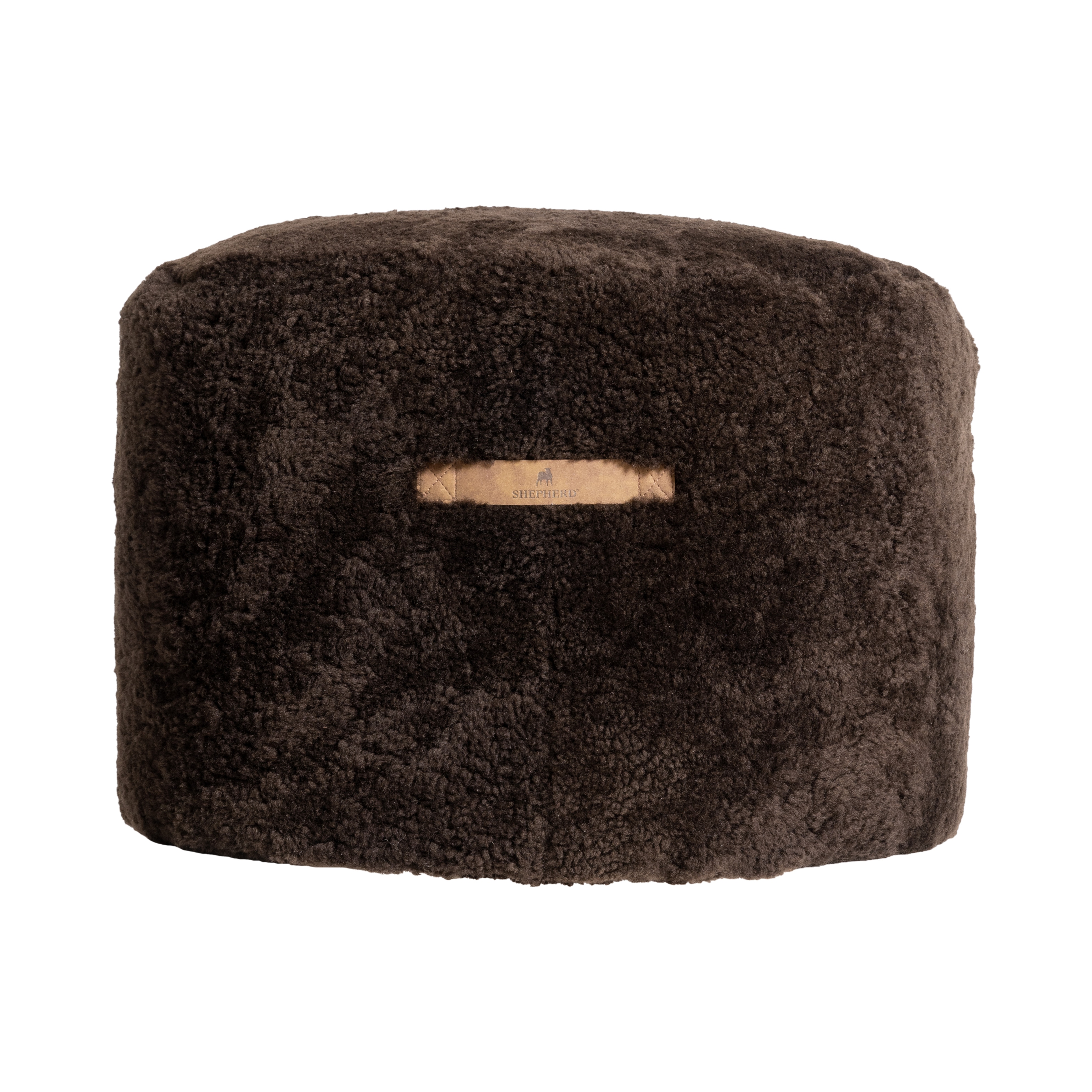 Shepherd Eva is a round pouf made of short-haired sheepskin.