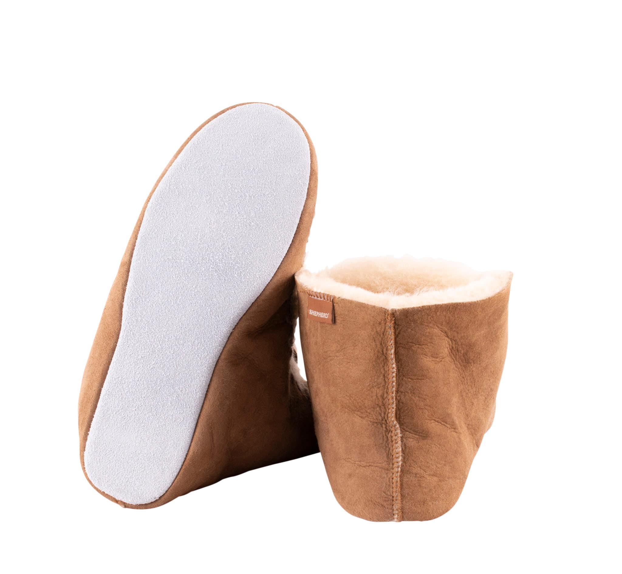 Shepherd Nova are a pair of pliable sheepskin slippers which are slightly higher than ankel high.