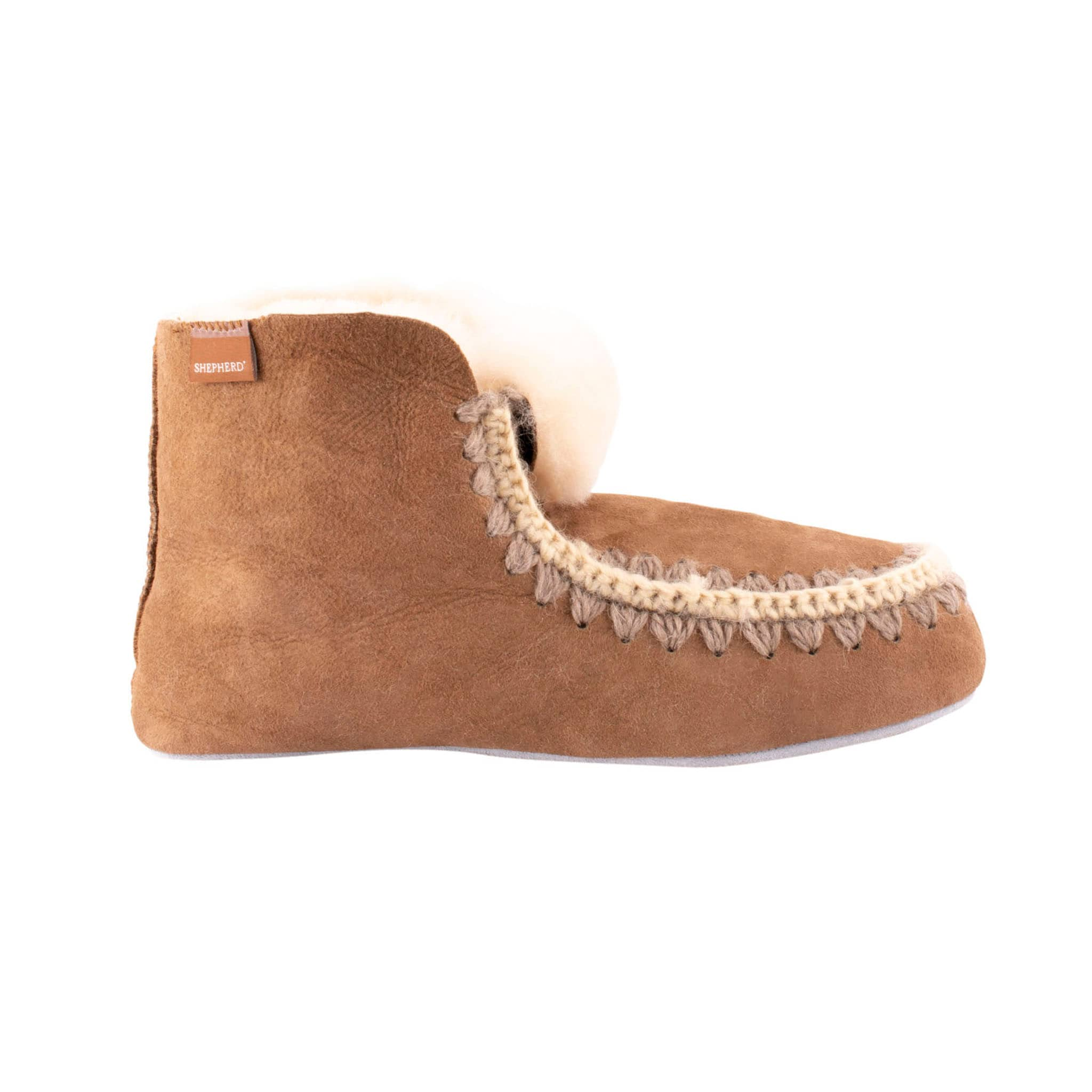 Shepherd Nova are a pair of pliable sheepskin slippers which are slightly higher than ankel high.