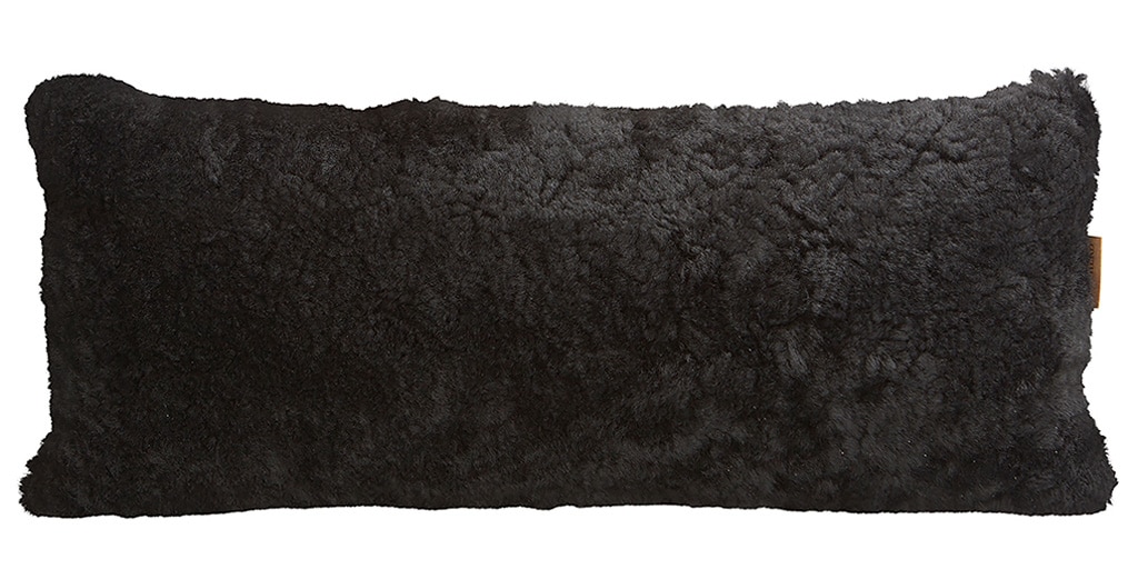En kudde i korthårigt mjuk fårskinn med sitt ursprung ifrån Australien